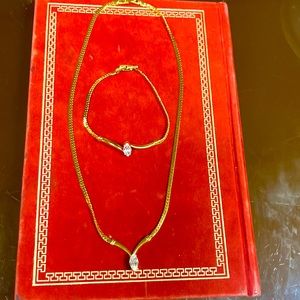 Avon vintage gold tone necklace with matching bracelet. Cubic zirconium stone.